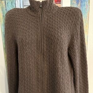 A CHOCOLATE BROWN ZIP UP SWEATER